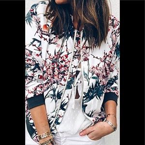 ZARA jacket has a zipper.